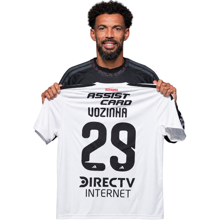 Vozinha holding a Colo-Colo number 29 jersey